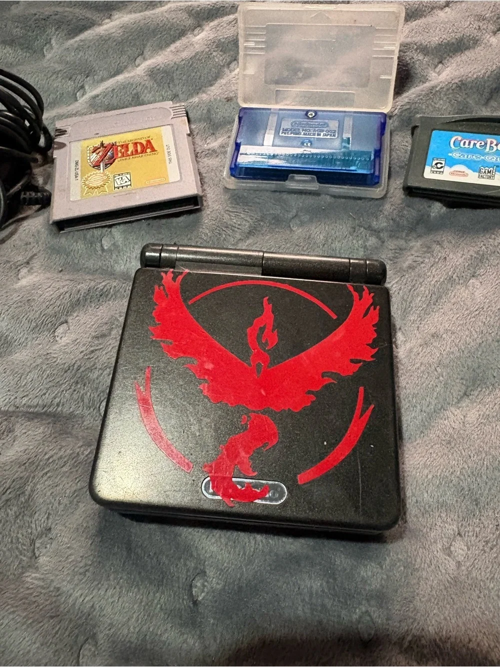 Nintendo Game Boy Advance SP Black with Pokémon sapphire, Zelda, Care Bears